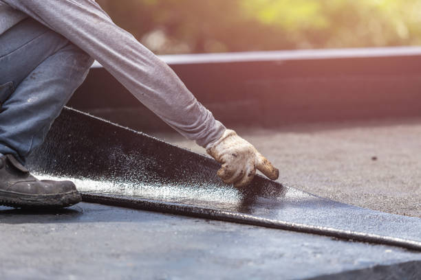 Professional Basement Waterproofing technician working in Enon, VA
